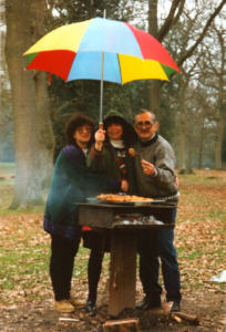 Athena, Linda and Theomidis barbequeing in the rain